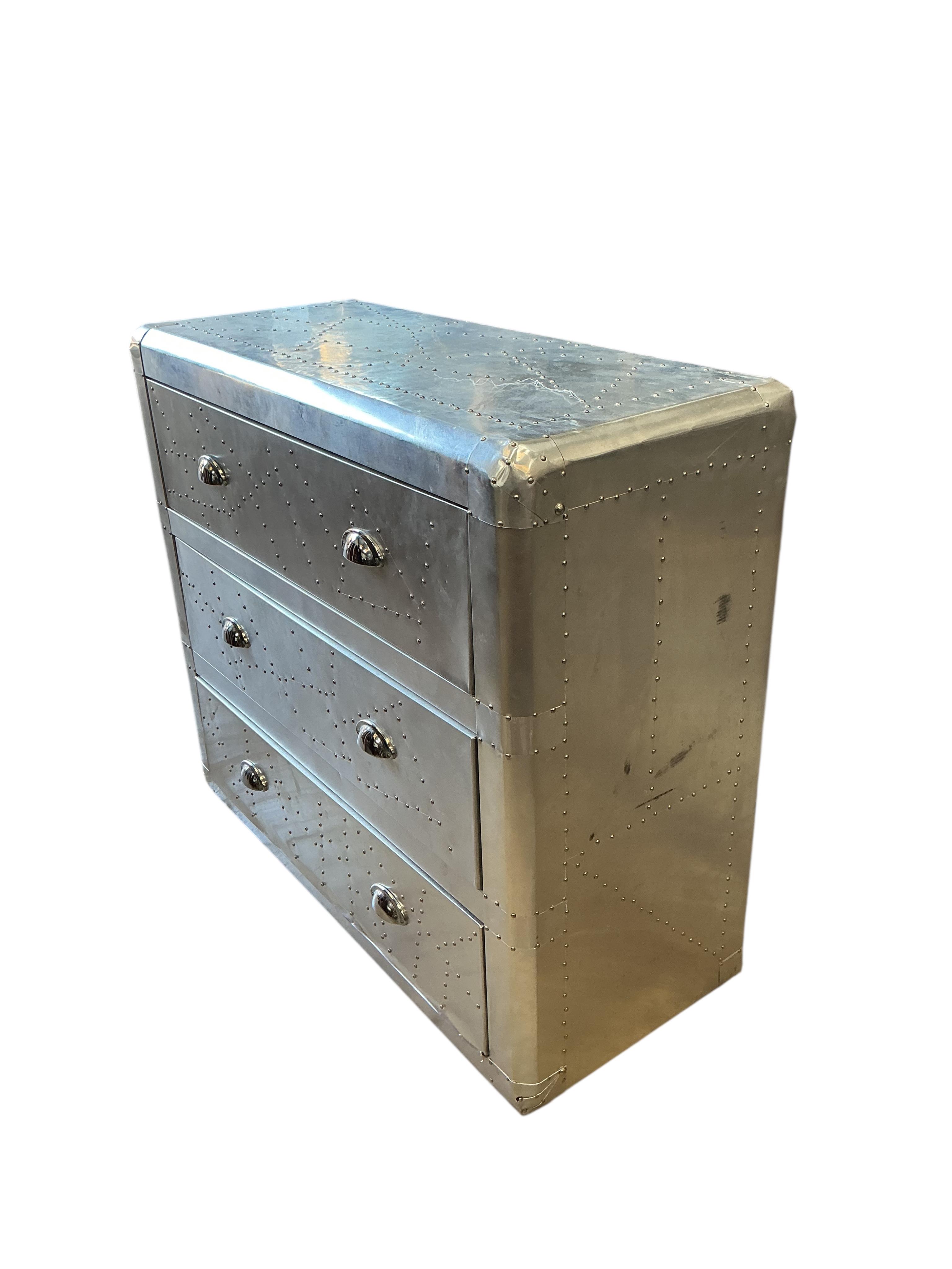 A pair of Contemporary aeronautical style aluminium mounted chest of three drawers, width 90cm, depth 38cm, height 79cm